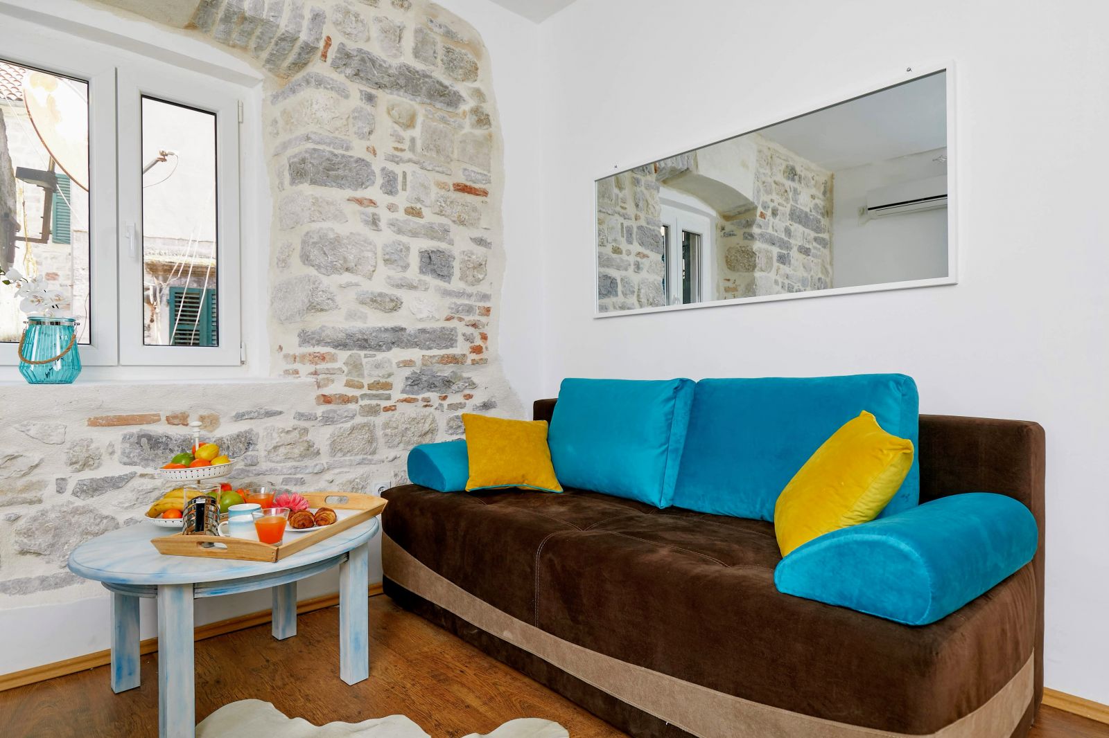 Kotor, Montenegro, stone wall living room and sofa